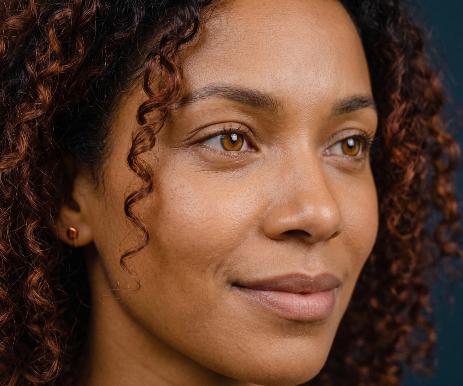 Autumn example — warm golden-brown skin, auburn curls, amber eyes